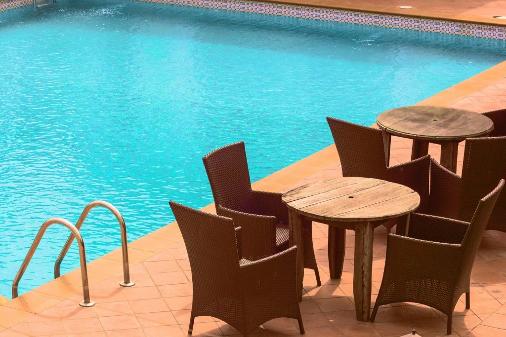 Set of table and chairs near pool